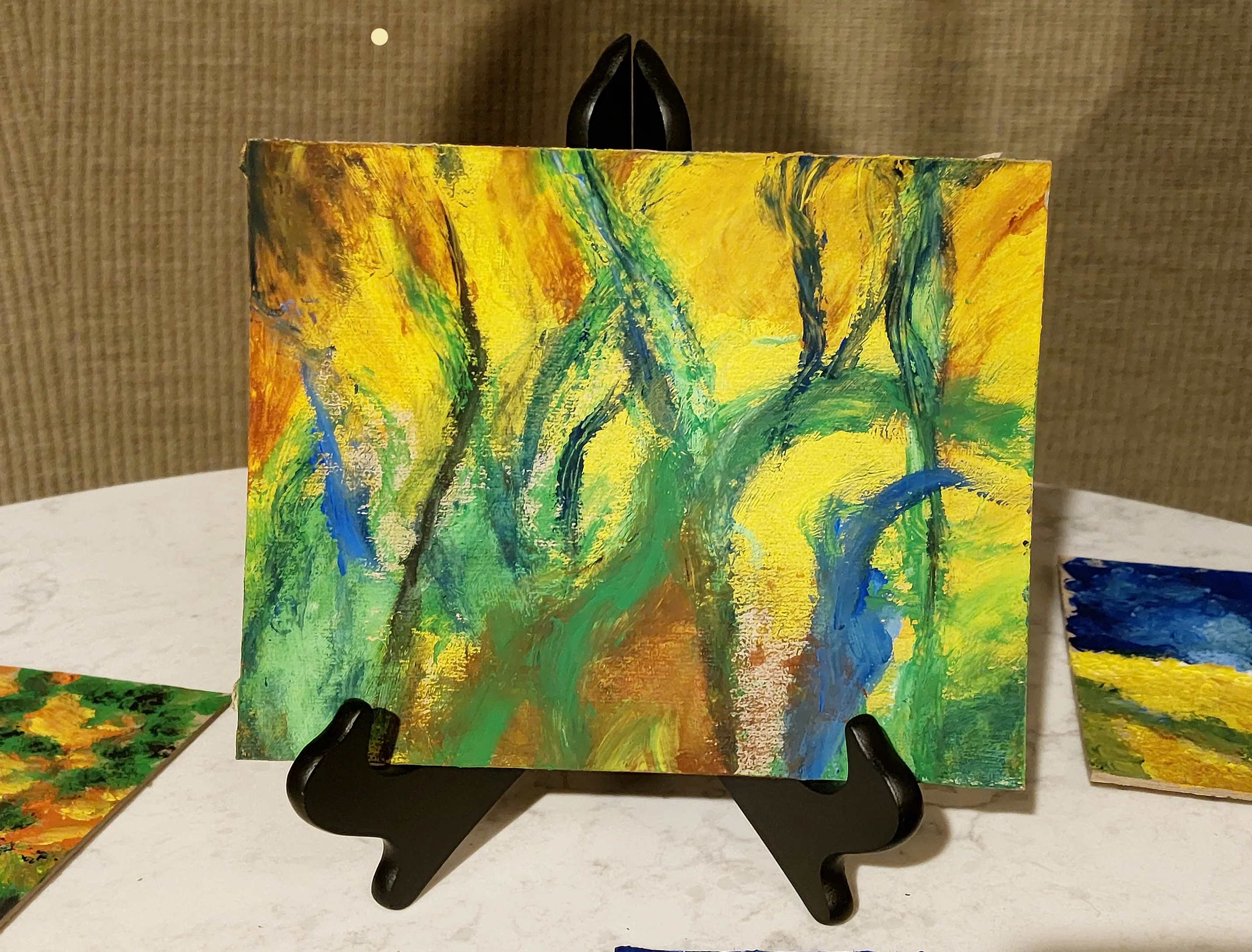 Abstract painting with flowing yellow, green, and blue in Van Gogh-style expressive strokes