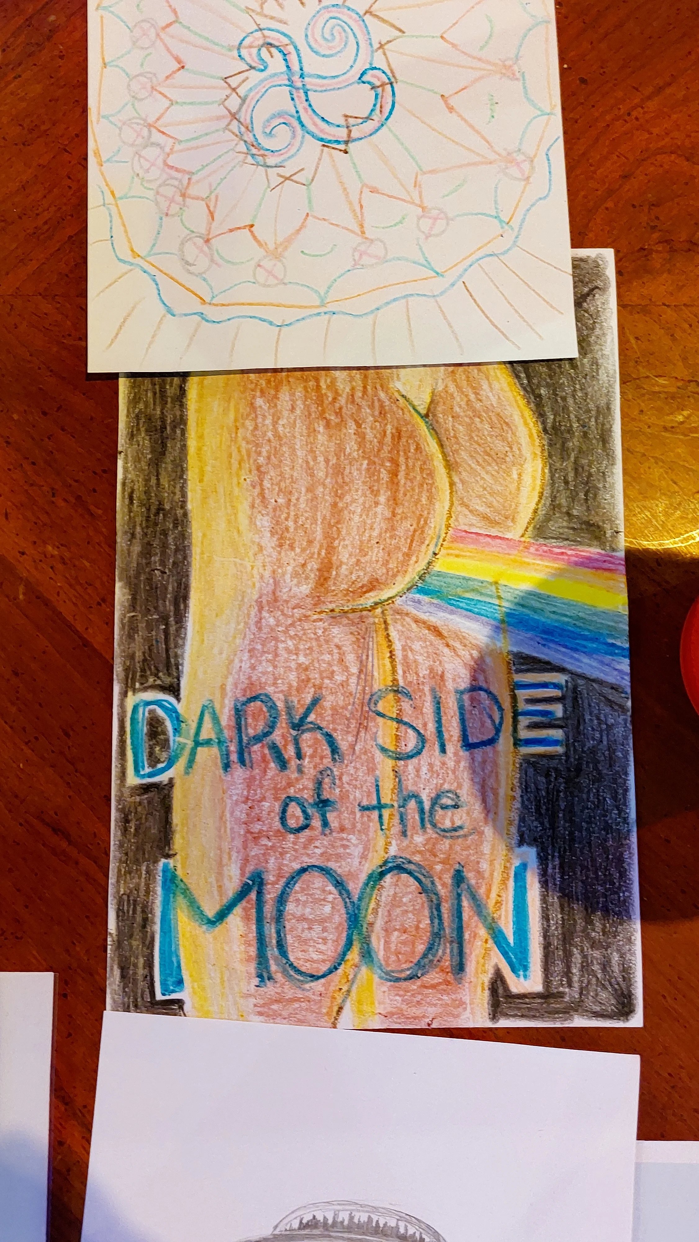 Colored pencil record cover design inspired by Dark Side of the Moon with prism rainbow